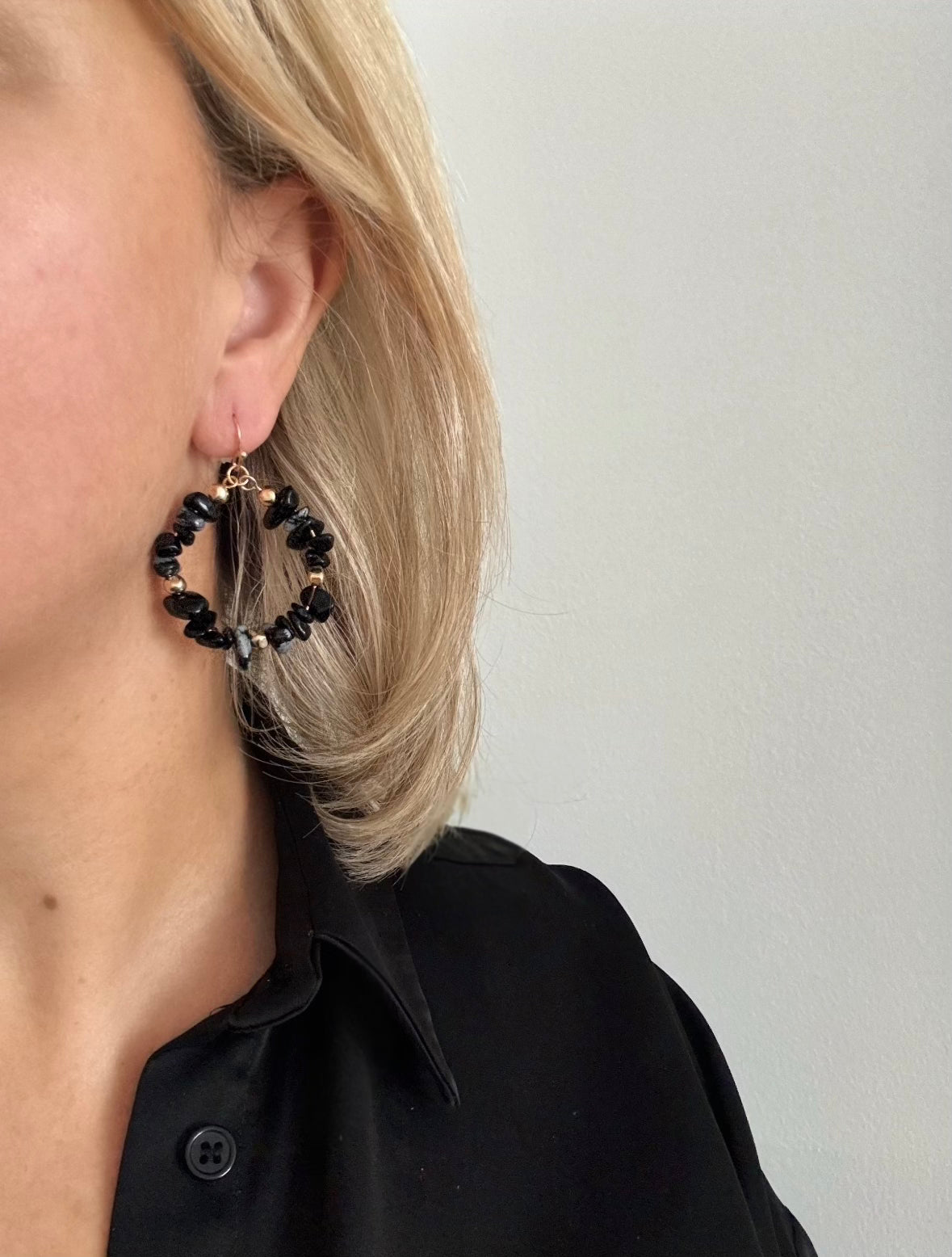 Model wearing semi precious earrings 