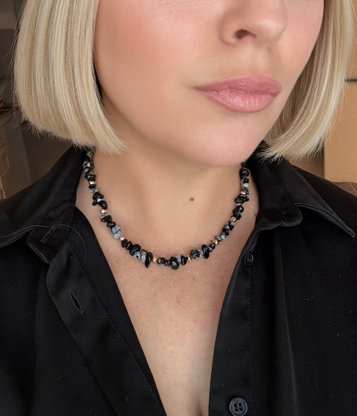 Model with blonde bob & necklace 